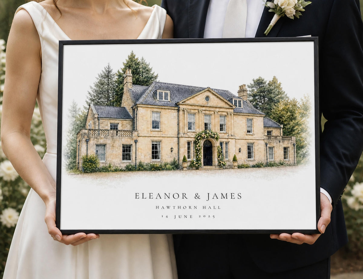 A newly married couple holds a black-framed personalised watercolour-style portrait of their wedding venue.